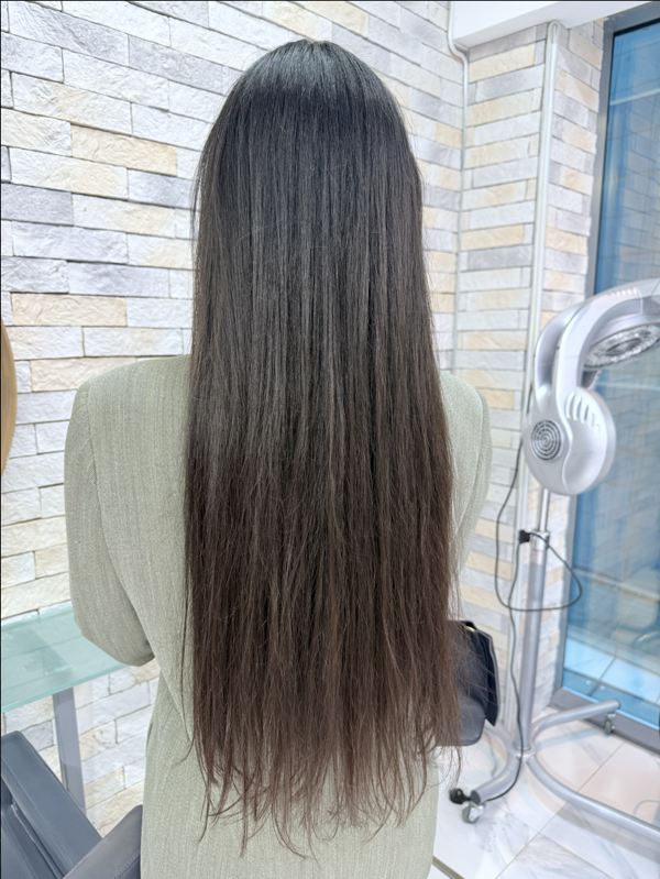 Invisible Fringe Blending. A smart hot-climate solution. We blended growing fringe sections with micro extensions around the face for a clean, elegant result.