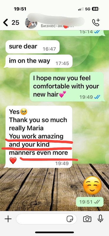 Client review photo: stunning hair extension transformation in Dubai for added volume and length.